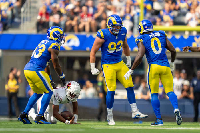 Los Angeles Rams' Ernest Jones (53), Jonah Williams (92) and Byron Young (0) celebrating a sack.